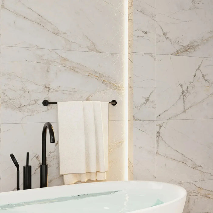 Bright, modern bathroom with Mystic Blanco porcelain tiles on the floor, adding elegance with their stone-inspired texture and matt finish.