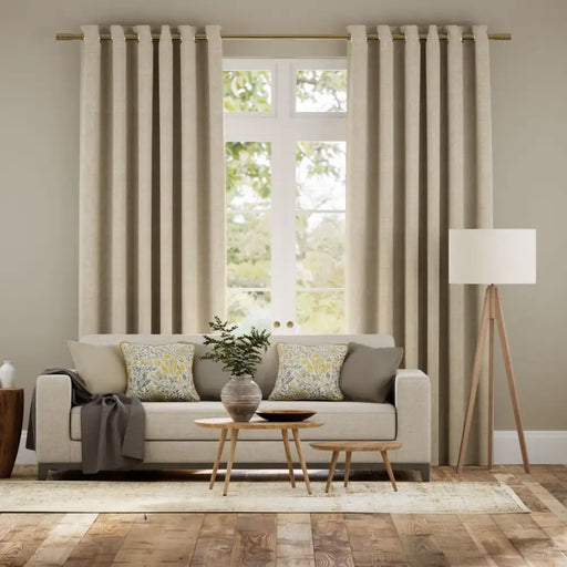 Natural linen-look eyelet curtains with double-faced blackout lining for a clean, tailored look