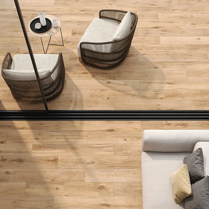 Inside and outside with Naturwood Moka tiles, creating a warm wood-look floor.