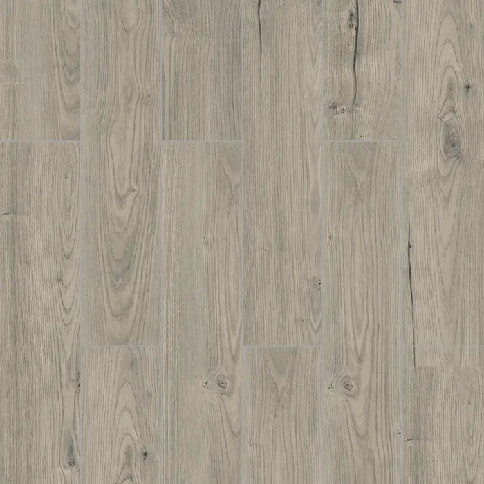 Close-up of Orion Shimmer laminate showing natural oak grain with a subtle shimmer, beveled edges, and a 12mm thick high-density core for strength and stability.