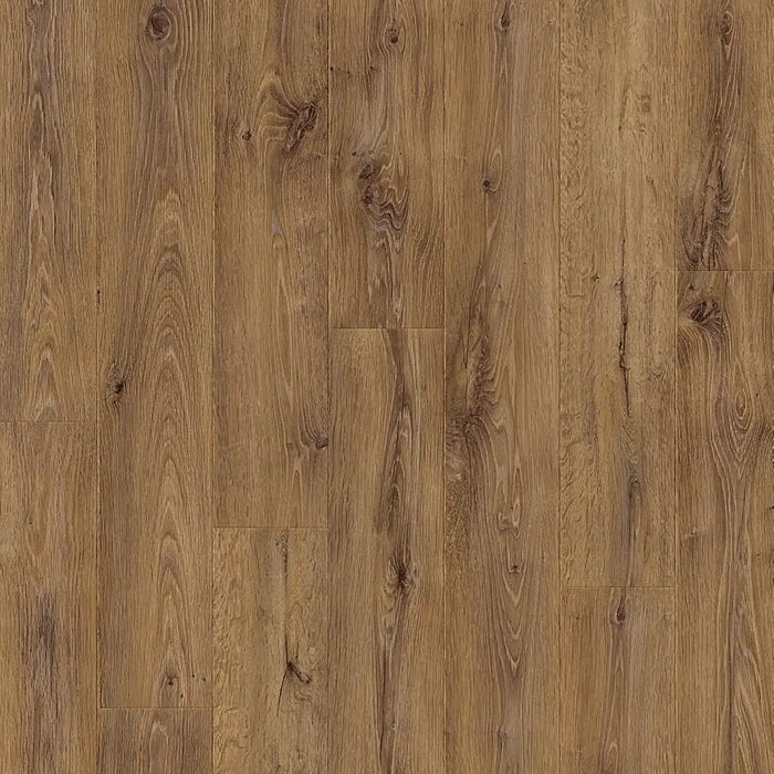 Close-up view of Pergo Arendal Barnhouse laminate floor highlighting warm wood tones, textured grain, and a subtle matte finish with bevelled plank edges.
