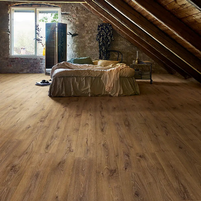 Warm, inviting room styled with Pergo Arendal Barnhouse laminate flooring, showcasing natural brown hues and realistic wood grain for a homely, rustic feel.