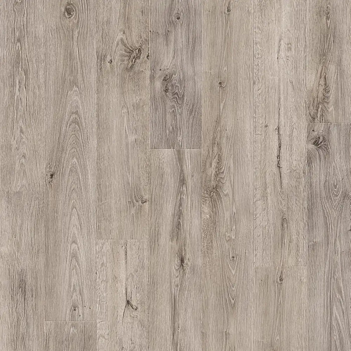 Detail shot of Pergo Arendal Grey Barnhouse laminate flooring showing textured grey wood grain, matte finish, and subtle bevelled edges.