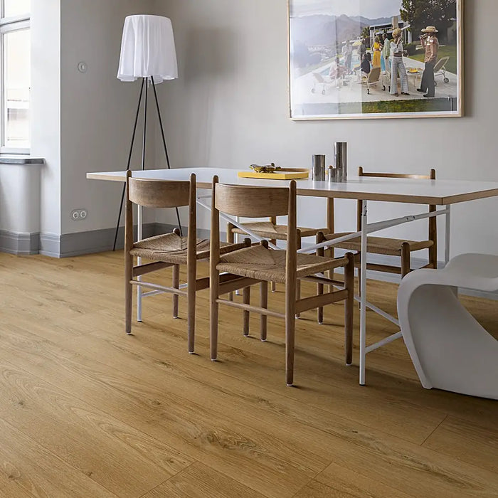 Dining room with Pergo Glomma Brown Eifel LVT flooring in a rich dark brown wood tone.
