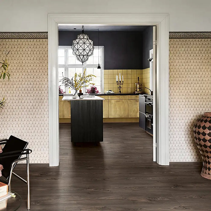 Open-plan living area with Pergo Glomma Dark Eifel LVT flooring, featuring modern dark wood tones.