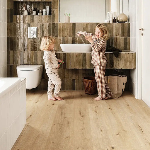 Bright bathroom with Pergo Glomma Natural Irish LVT flooring in a classic light oak tone.