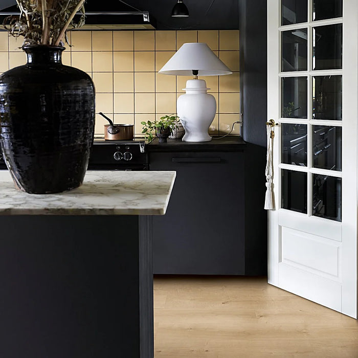 Kitchen featuring Pergo Namsen Bright Ardeche LVT, with light oak planks enhancing the airy feel.