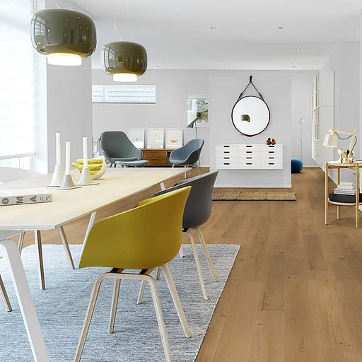 Open-plan dining room with Pergo Namsen Natural Forest LVT in classic mid-oak.