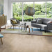 Minimalist living space with Pergo Namsen Pale Ardeche LVT in soft beige oak.