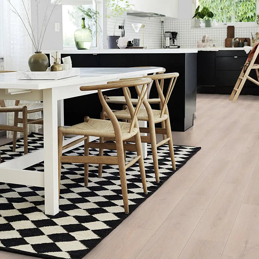 Kitchen with Pergo Namsen White Norwegian LVT, showing pale, natural oak tones that brighten the space.