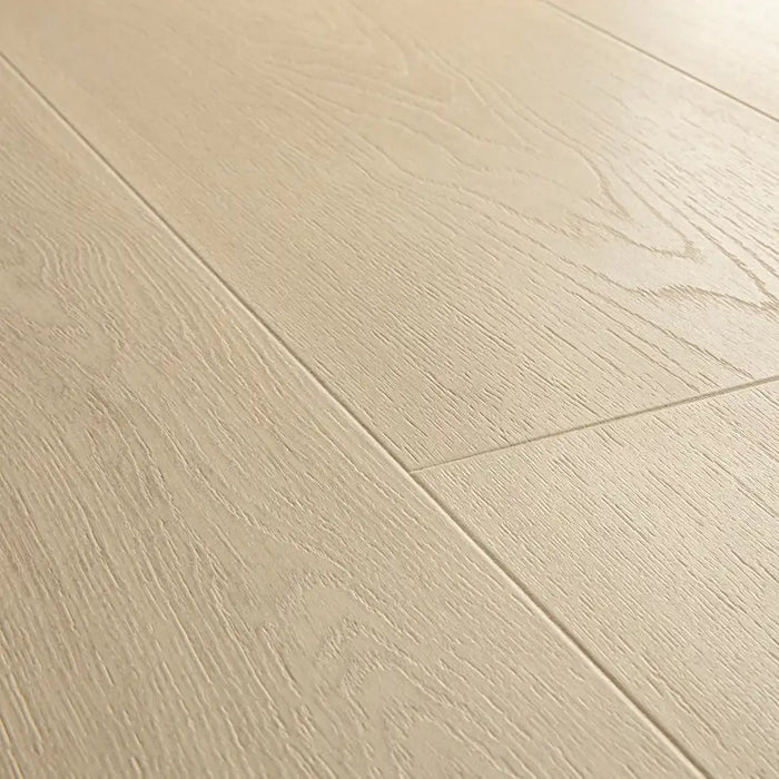 Close-up of Pergo Odense Clay laminate highlighting its warm brown tones, textured woodgrain, and subtle matte surface with deep bevels.