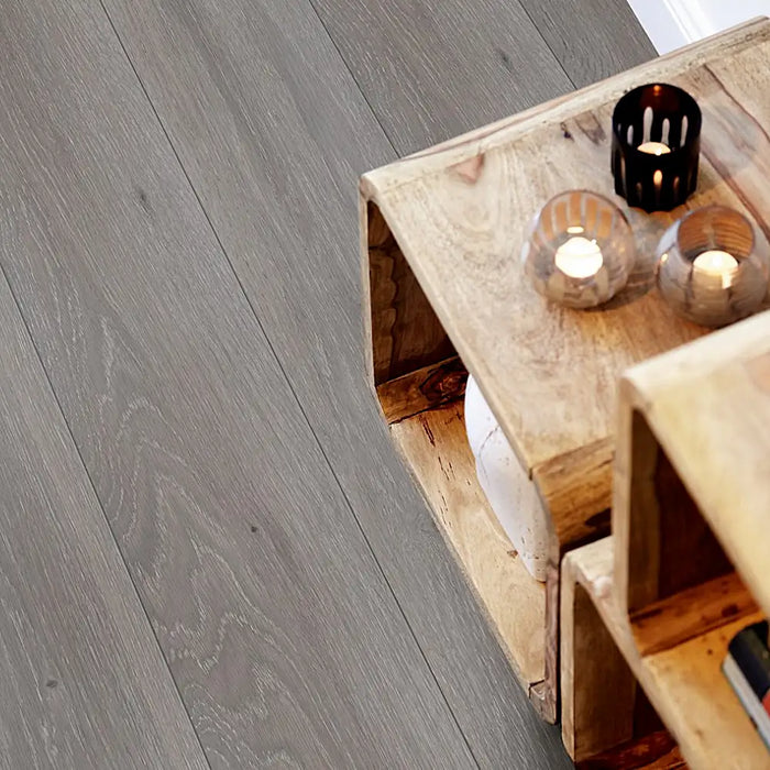 Pergo Visby Urban Grey laminate flooring in a modern living space with sleek, cool-toned grey planks and a clean, urban aesthetic.