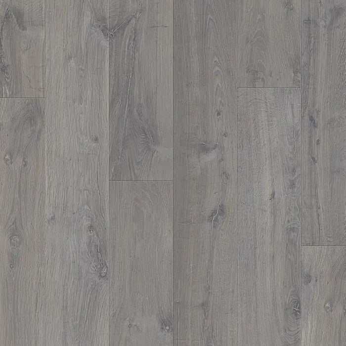 Close-up of Urban Grey laminate plank showing realistic wood grain detail, light grey colouring, and a subtle matte texture.