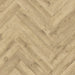 Close-up of Beige Century herringbone LVT plank highlighting soft beige wood grain.