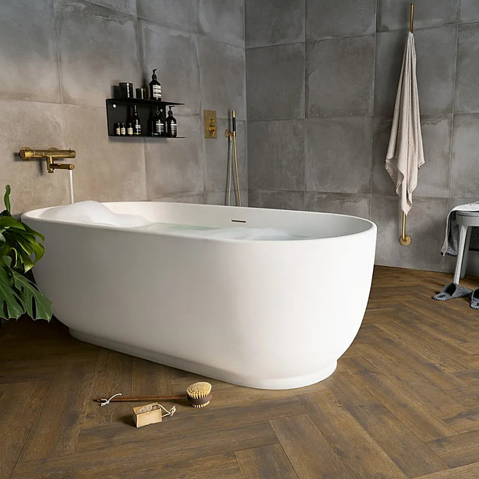 Dark Century herringbone LVT flooring in a stylish bathroom with rich brown tones.