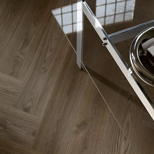 Dark Norwegian herringbone LVT flooring in a modern dining room with rich wood texture.