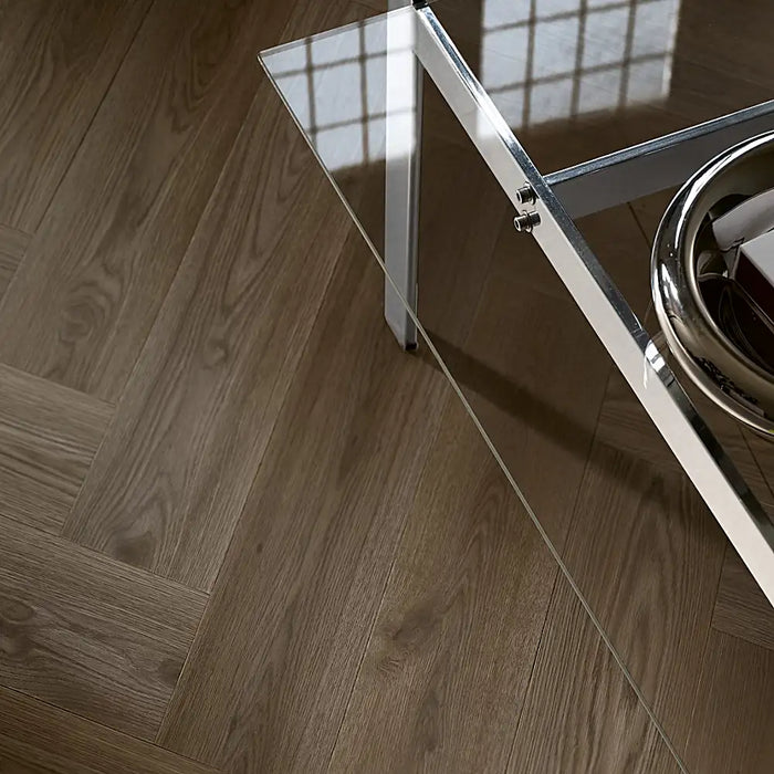 Dark Norwegian herringbone LVT flooring in a modern dining room with rich wood texture.