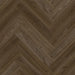 Close-up of Dark Norwegian herringbone LVT plank with dark brown tones and fine grain.
