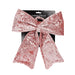 Close-up of Pink Velvet Bow showing rich velvet texture and neatly tied shape.