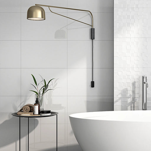 Bright bathroom with Polar Blanco Gloss 33.3x55 wall tiles, creating a polished and modern wall finish.