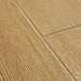 Close-up of Quick-Step Majestic Desert Oak Warm Natural laminate flooring, highlighting intense golden oak grain and silk matt texture.