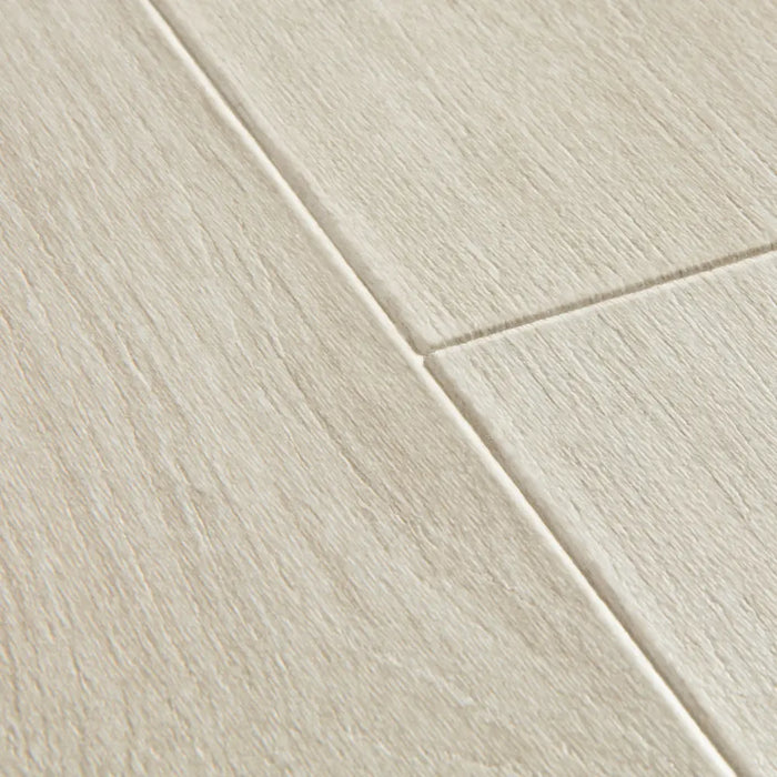 Close-up of Quick-Step Majestic Woodland Oak Light Grey flooring showing extra-matt finish and subtle wood grain texture.