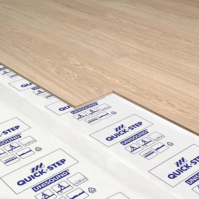 Quick-Step Unisound Underlay unrolled over a subfloor, with laminate boards ready for fitting.