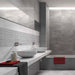 Bathroom interior featuring RLV Fred Gris wall tiles as a feature wall, enhancing the modern design.