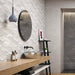 Bathroom wall styled with RLV Persa Gris 33.3x55 wall tiles, showcasing a decorative grey relief finish.