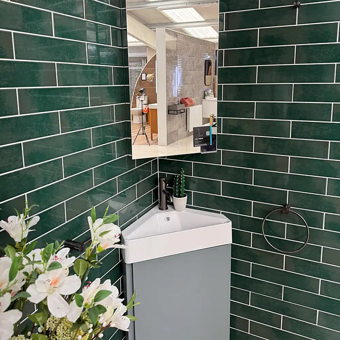 Bathroom wall styled with Reality Palm wall tiles, showcasing a fresh green handmade look.
