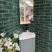 Bathroom wall styled with Reality Palm wall tiles, showcasing a fresh green handmade look.