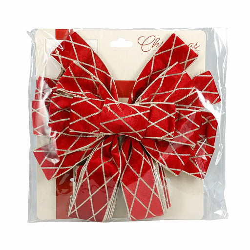 Close-up of red tree top bow highlighting smooth velvet texture.