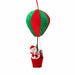 Close-up of red and green striped balloon ornament with Santa figure hanging below.