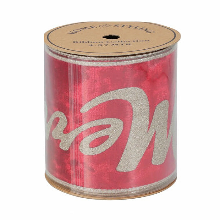 Close-up of red ribbon showing elegant gold ‘Merry Christmas’ print.