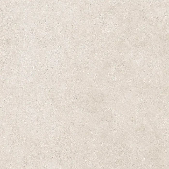 Detailed view of Reggio Marfil Porcelain tile surface, highlighting its smooth texture and natural beige veining.