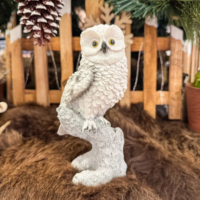 Close-up of Right Hand Owl On Tree Trunk Ornament showing feather detailing and textured tree trunk.