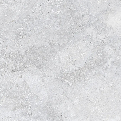 Detailed close-up of Roden Perla Natural porcelain tile showing its smooth matt surface and gentle grey tone.