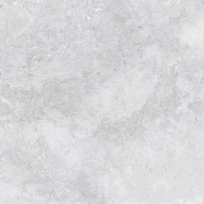 Detailed close-up of Roden Perla Natural porcelain tile showing its smooth matt surface and gentle grey tone.