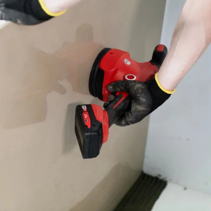 Rubi Quake Energy CAS Tile Vibrator with dual handle, suction cup, and LED light, ideal for eliminating air bubbles under tiles and precise tile adjustment.