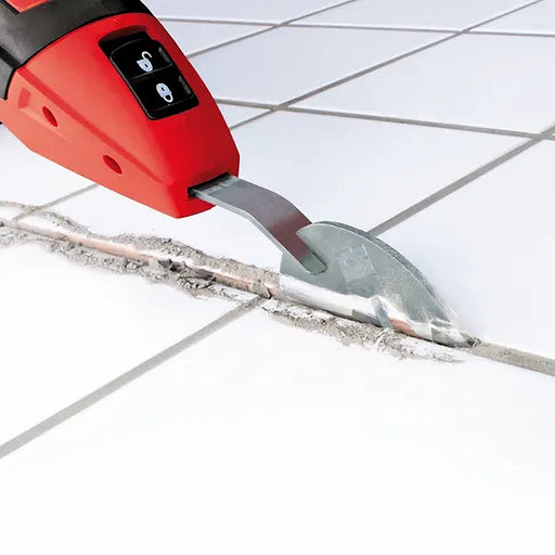 Rubi Rubiscraper-250 electric grout scraper in action, removing grout precisely between tiles without creating dust.