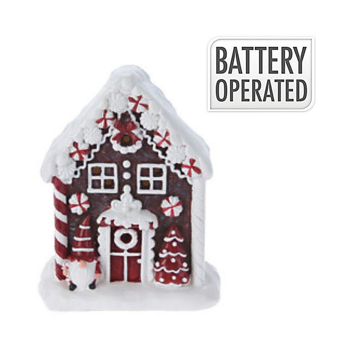 Close-up of Santa Cookie House showing Santa figure, candy details, and illuminated windows.