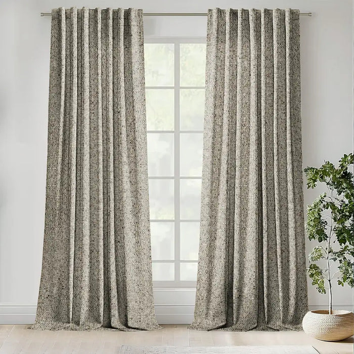 Scatter Box Caden Cream Sage textured eyelet curtains fully lined and hanging at a large window in a modern living room