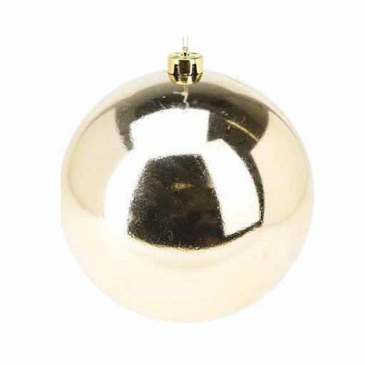 Close-up of shiny gold bauble showing reflective surface and smooth texture.