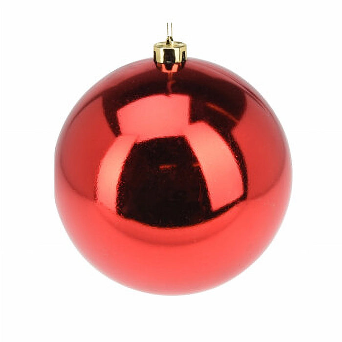 Close-up of shiny red bauble showing glossy reflective finish.