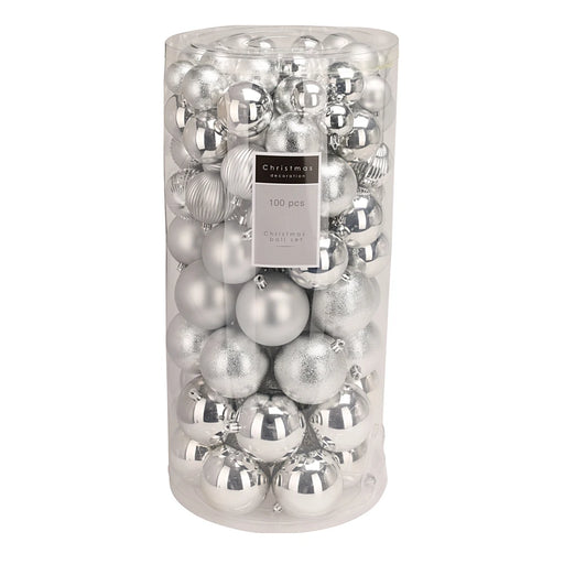 Close-up of silver baubles showing assorted glossy and matt textures.