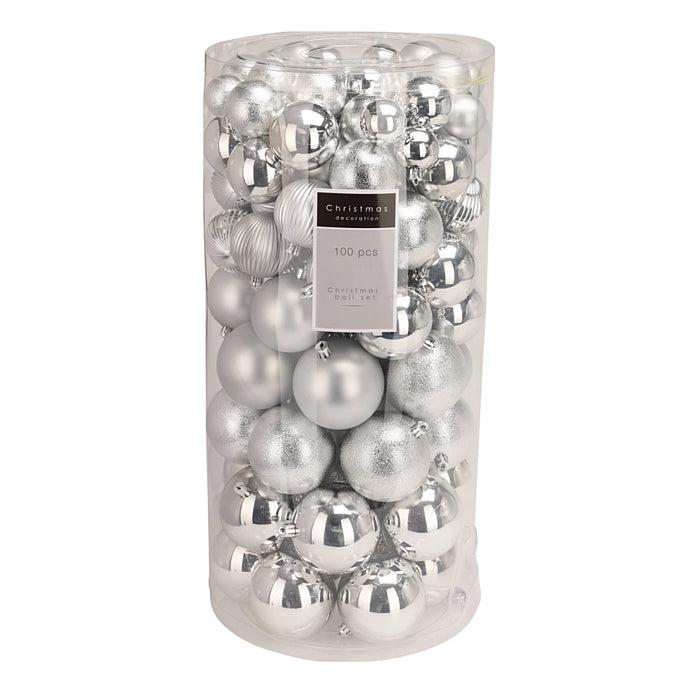 Close-up of silver baubles showing assorted glossy and matt textures.