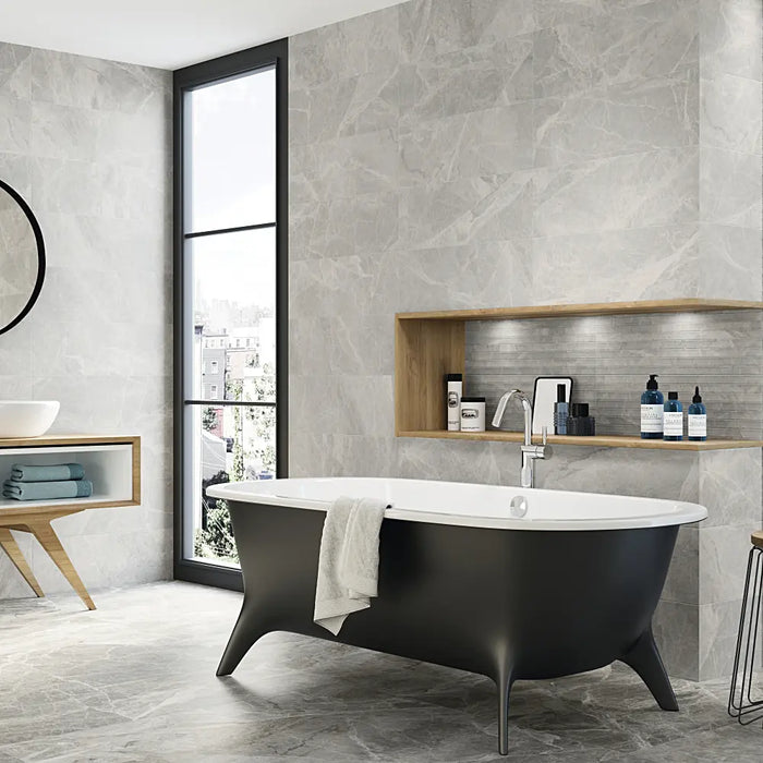 A bathroom wall finished with Silver Pearl Matt tiles, giving a soft grey, contemporary look.