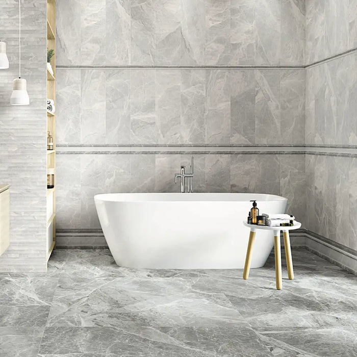 A bathroom wall finished with Silver Pearl Matt tiles, giving a soft grey, contemporary look.