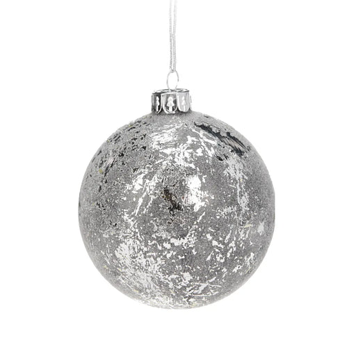 Close-up of silver textured Christmas bauble showing detailed surface pattern and reflective finish.
