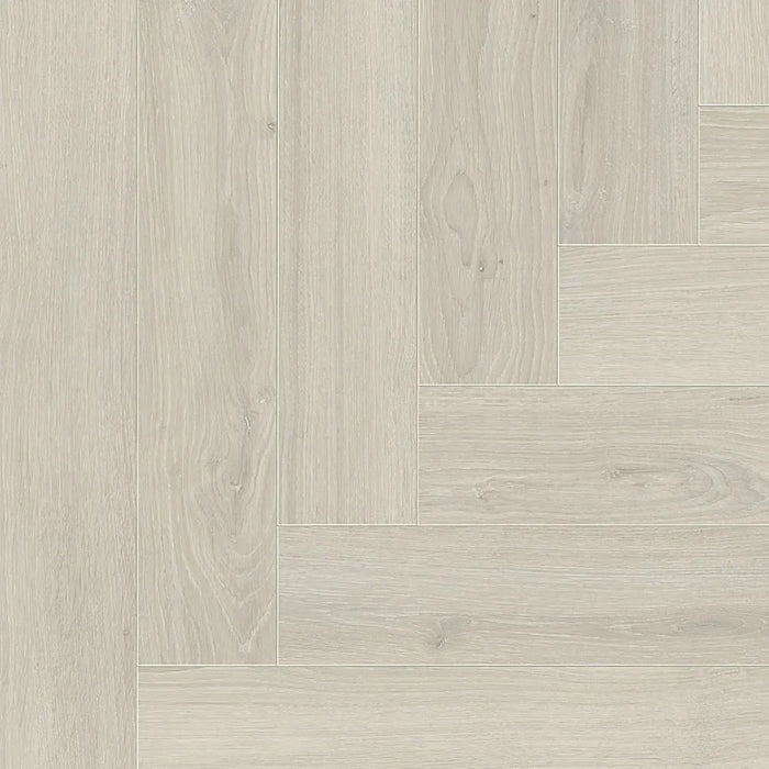 Close-up of Skyline White Herringbone laminate plank highlighting its natural matt surface, light oak texture, and realistic woodgrain detail.